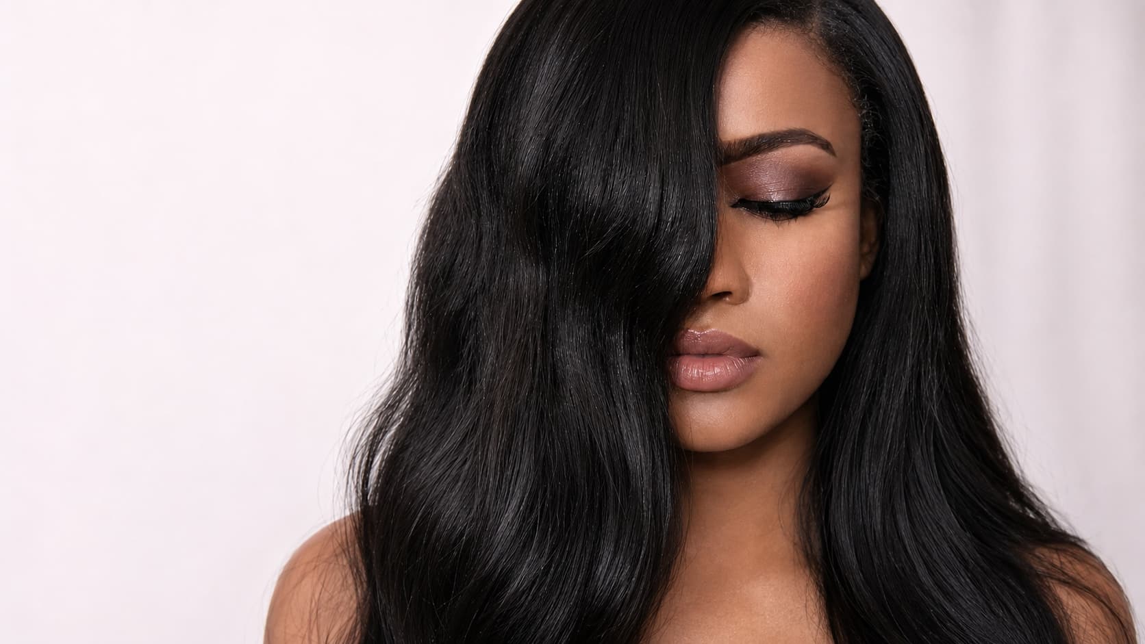 Black woman with sleek silk-pressed hair at True Virgin Beauty Bar